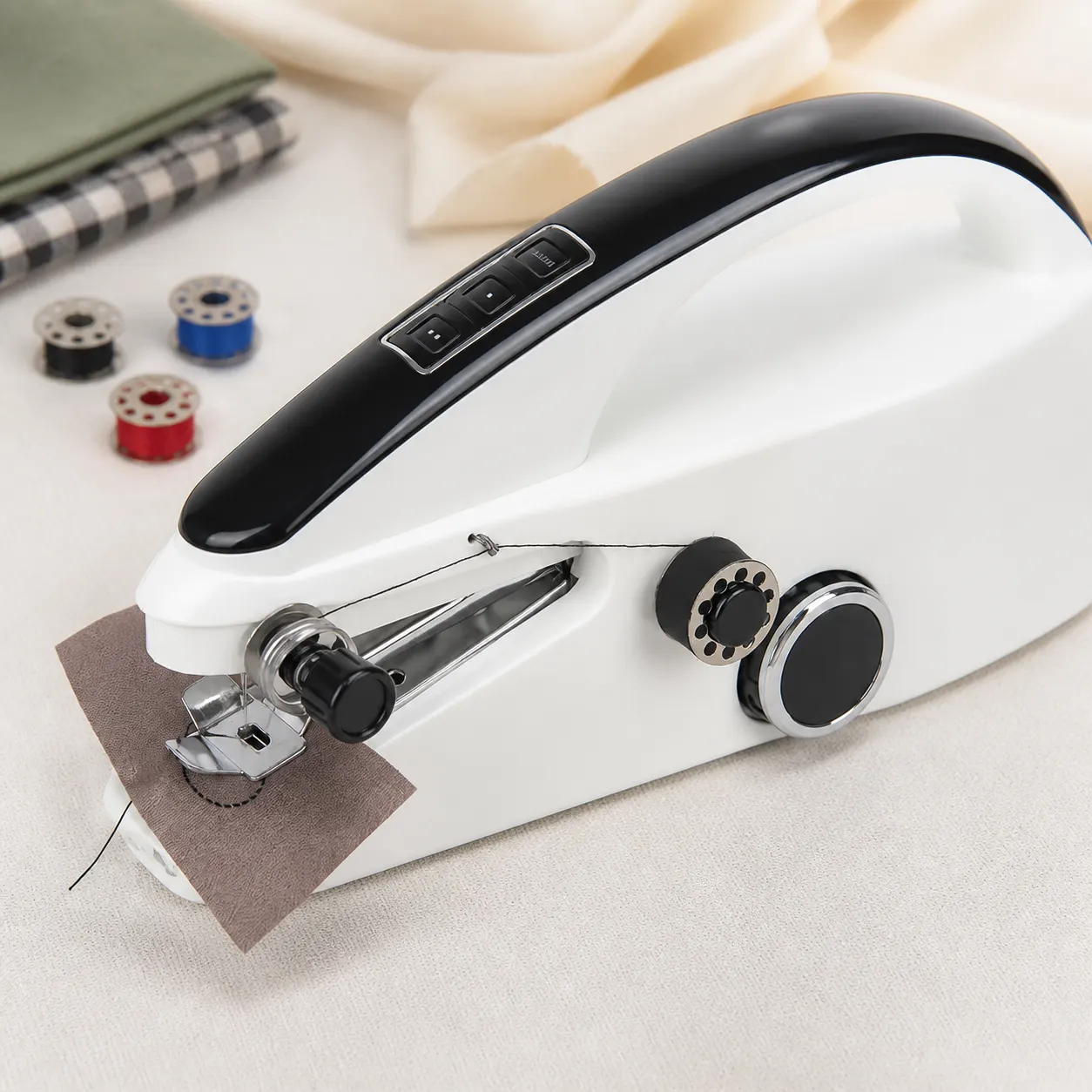 Handheld Sewing Machine controls and screen